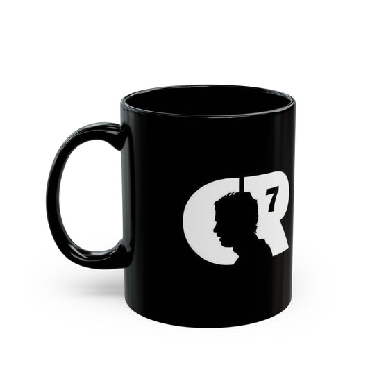 Black mug with white silhouette and 'CR7' logo on a white background